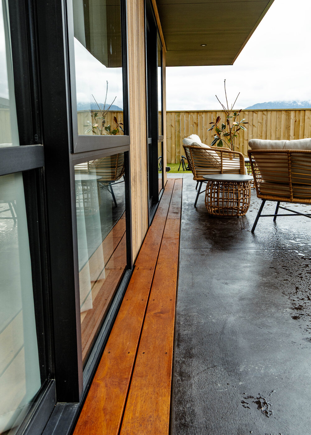 Wide view of finished outdoor deck with door access
